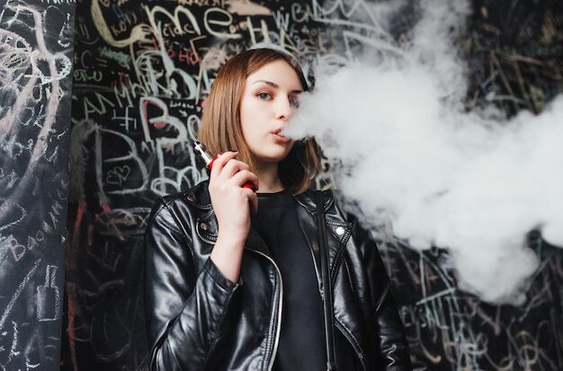 beautiful young woman inhaling smoke young girl vaping 8353 5989